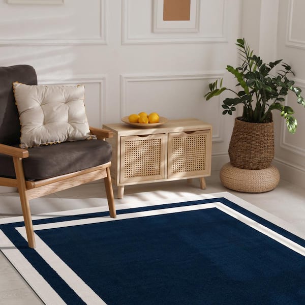 https://images.thdstatic.com/productImages/d665d48a-d6fe-47d2-a613-69d4aed7eeb6/svn/navy-blue-cream-camilson-area-rugs-cry1003-nvy-2x7-hd-76_600.jpg