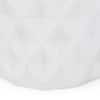 Close-up detail of the textured surface of the white side table.