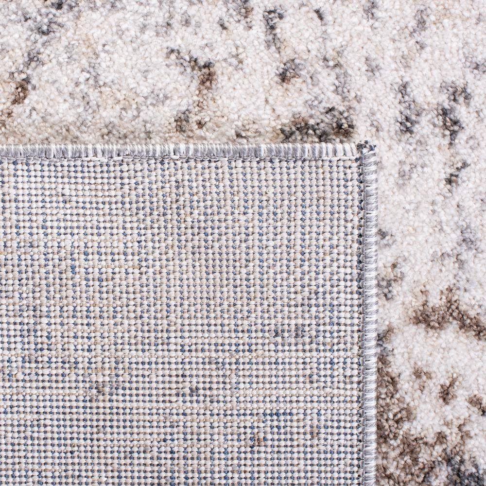 Ivory and Grey Abstract 8' x 10' Synthetic Area Rug