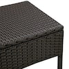 Close-up of the woven top of the dark brown wicker side table.