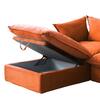 Close-up of the orange sofa cushion being lifted to reveal storage underneath.