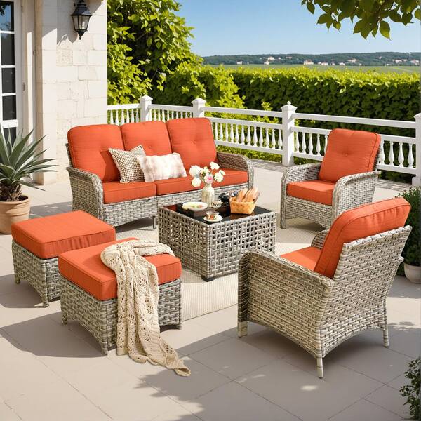 Gerbera A 6-Piece Wicker Patio Conversation Seating Set with Solar Lighted Coffee Table and Orange Red Cushions
