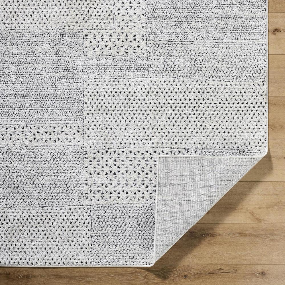 Ivory and Black Geometric Patchwork Area Rug, 6'7" x 9'