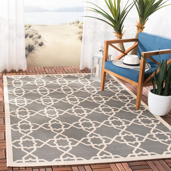 https://images.thdstatic.com/productImages/d7541108-6e78-4eab-bbef-d793e8c6eb11/svn/gray-beige-safavieh-outdoor-rugs-cy6032-246-9-e1_600.jpg