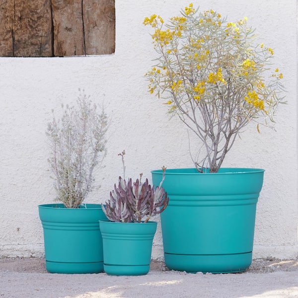 Saturn 12 in. Bermuda Teal Plastic Planter with Saucer