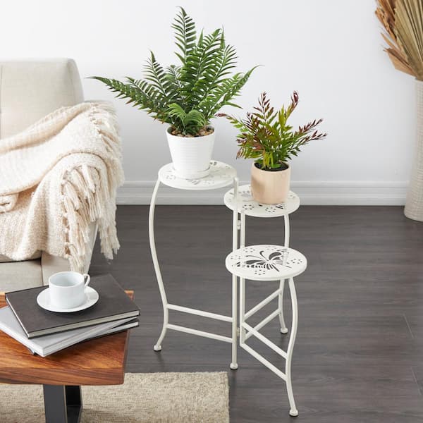 Litton Lane 24 in. White Metal Folding 3 Tier Plantstand with Butterfly Cutouts