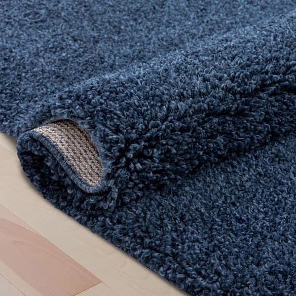 https://images.thdstatic.com/productImages/d780f011-3dc5-4378-b653-25787babdcde/svn/dark-blue-well-woven-area-rugs-ju-14-7-76_600.jpg