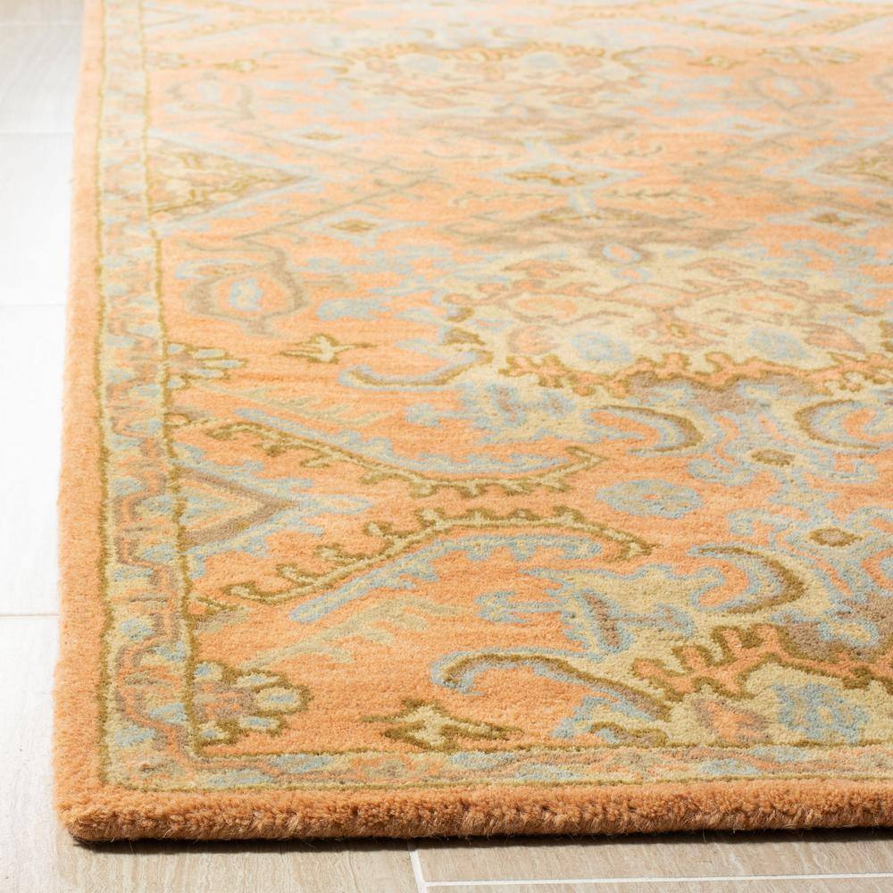 Handmade Light Blue and Terracotta Floral Wool Tufted Rug