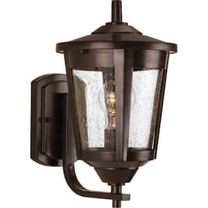 East Haven Collection 1-Light Antique Bronze Clear Seeded Glass Transitional Outdoor Medium Wall Lantern Light