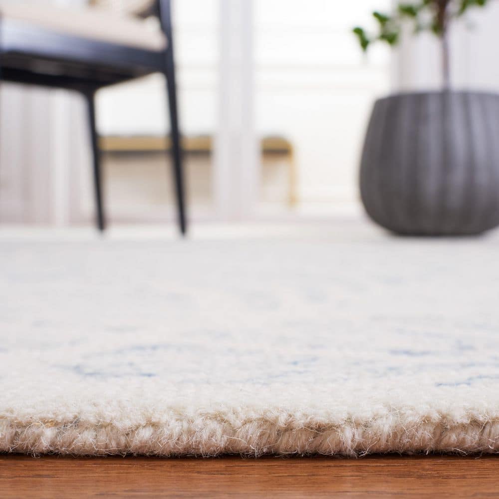 Ivory and Blue Handmade Wool Tufted 8' x 10' Area Rug