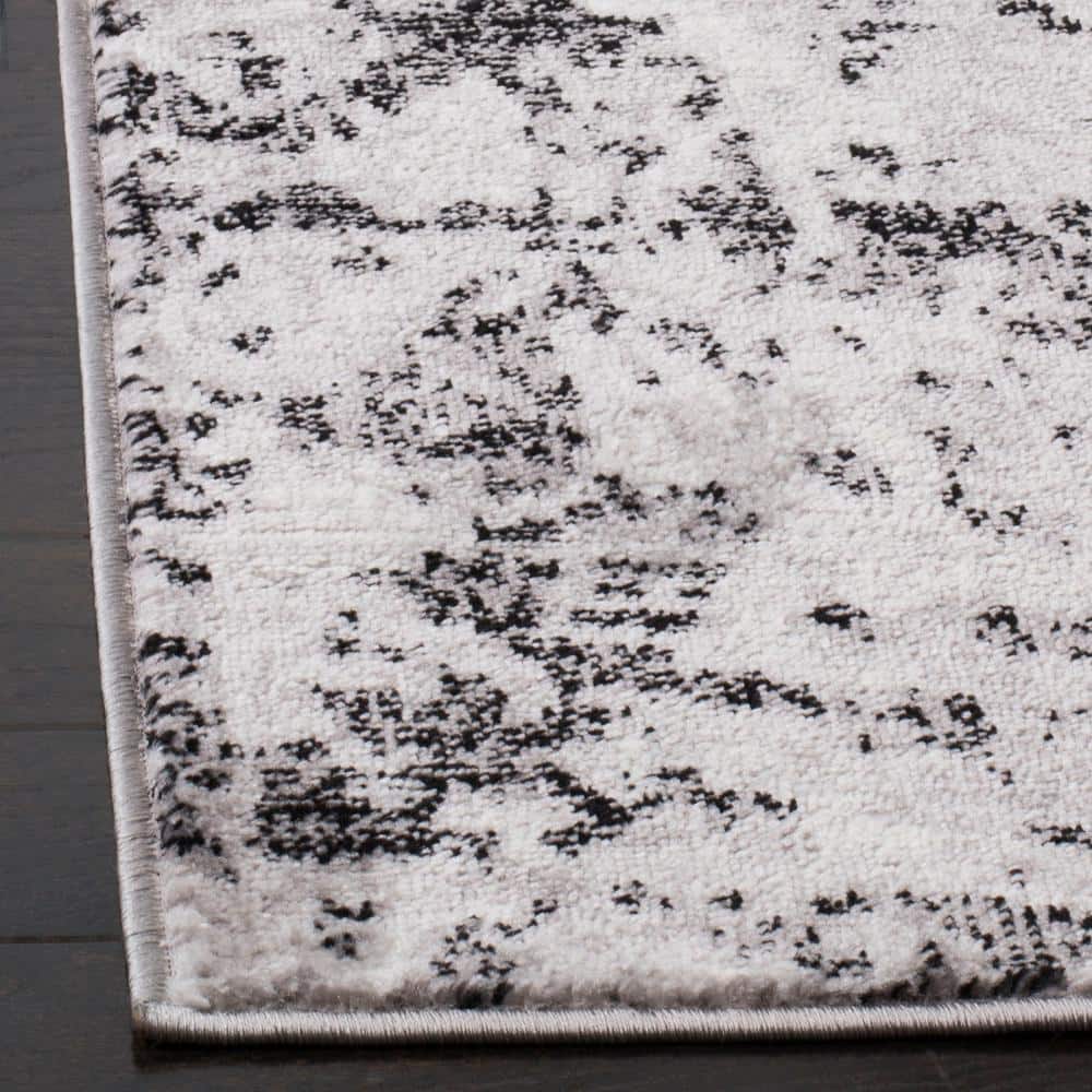 Charcoal and Ivory Abstract Synthetic 5'1" x 7'6" Reversible Area Rug