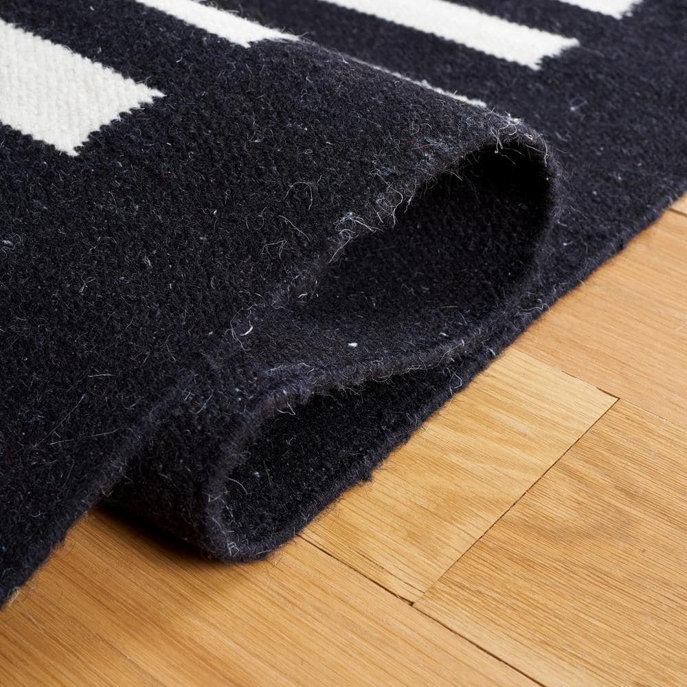 Handmade Black and Ivory Wool Striped 4' x 6' Area Rug