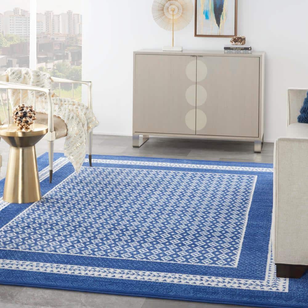 Ivory Geometric 7'10" x 10' Flat Woven Synthetic Area Rug