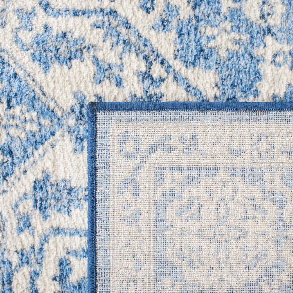 Ivory and Navy 8' x 10' Synthetic Washable Reversible Area Rug