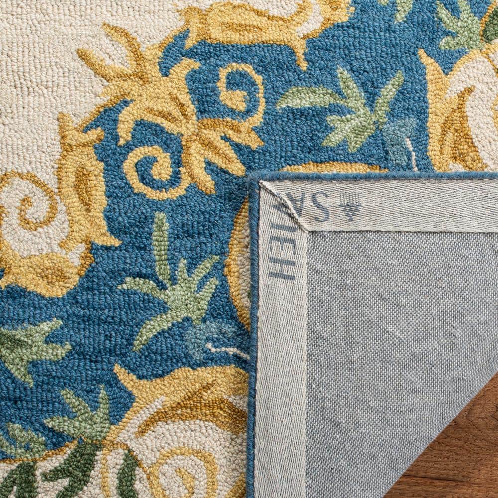 Handmade Cream and Blue Floral Wool Area Rug