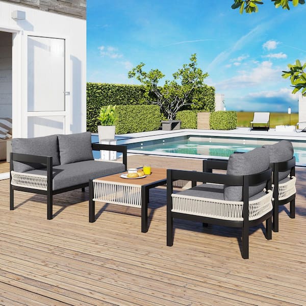 Zeus & Ruta 4-Piece Black Metal Outdoor Sectional Set with Gray Cushions and Table Rattan Decoration for Garden