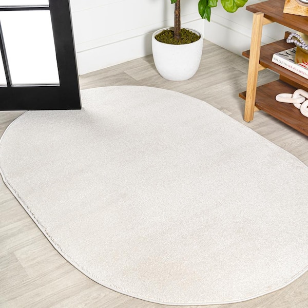 JONATHAN Y Haze Solid Low-Pile Cream 5 ft. x 8 ft. Oval Area Rug