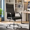 Black ergonomic chair in a home office setting.
