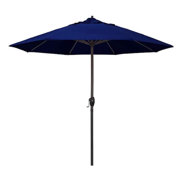 California Umbrella 9 ft. Bronze Aluminum Market Auto-tilt Crank Lift Patio Umbrella in True Blue Sunbrella