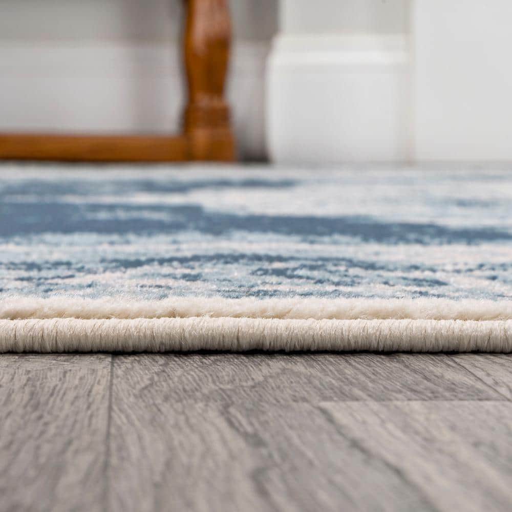Ivory and Blue Medallion 8' x 10' Synthetic Area Rug