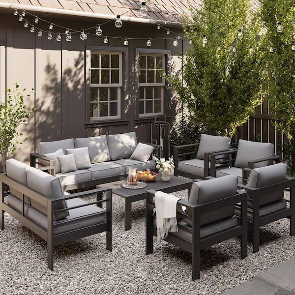 7-Piece Black Aluminum Patio Conversation Set with Light Gray Cushions and Coffee Table