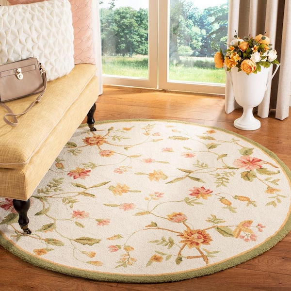 Chelsea Ivory 5 ft. x 7 ft. Oval Floral Border Speckled Area Rug
