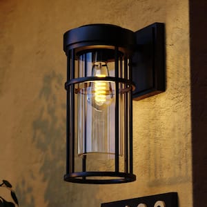 Crestline Black Aluminum 1-Light LED Compatible Dusk to Dawn Transitional Outdoor Cylinder Wall Sconce Clear Glass