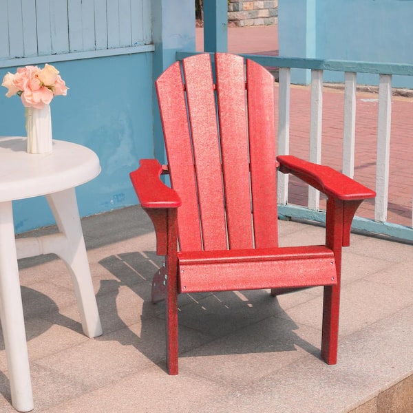 red adirondack chairs around fire pit