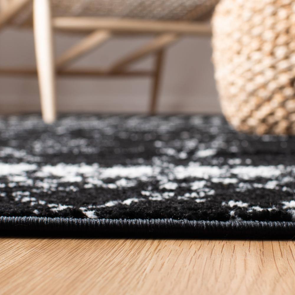 Boho-Chic Black/Ivory Synthetic 6' x 9' Hand-Knotted Area Rug