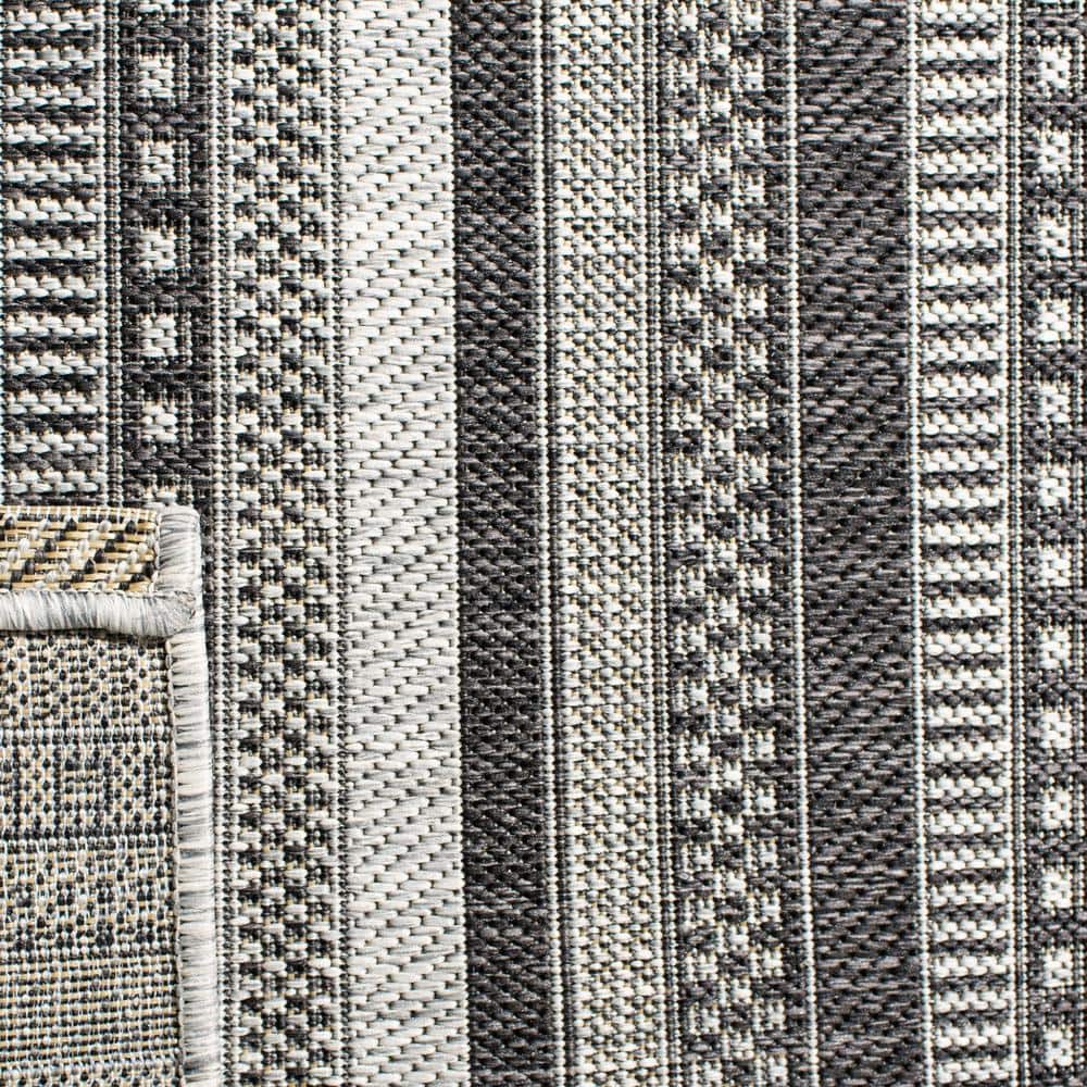 Black and Gray Striped 8' x 10' Synthetic Indoor/Outdoor Rug