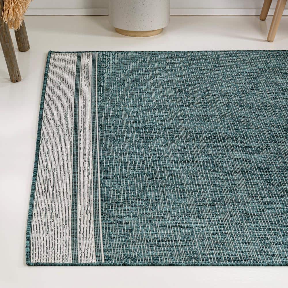Turquoise and Cream 4' x 6' Solid Synthetic Area Rug
