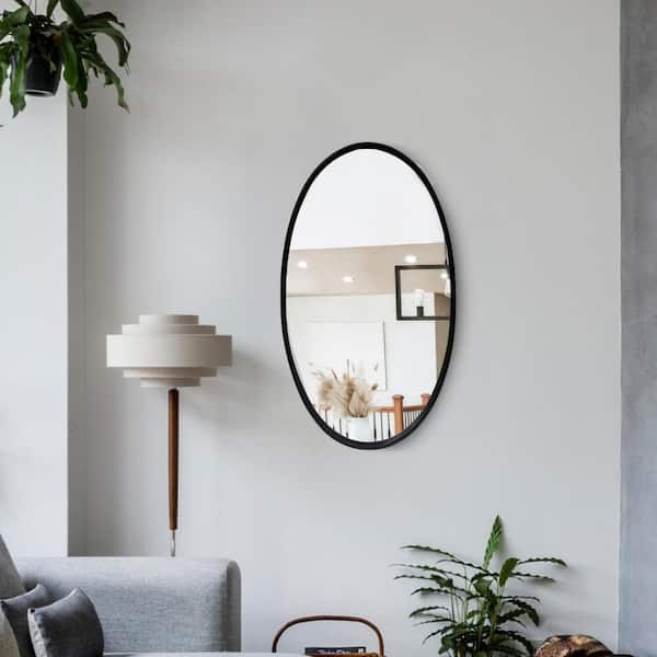 THE URBAN PORT 30.98 in. H x 0.79 in. W Black Oval Metal Wall Mirror with Framed Edges and Wooden Backing