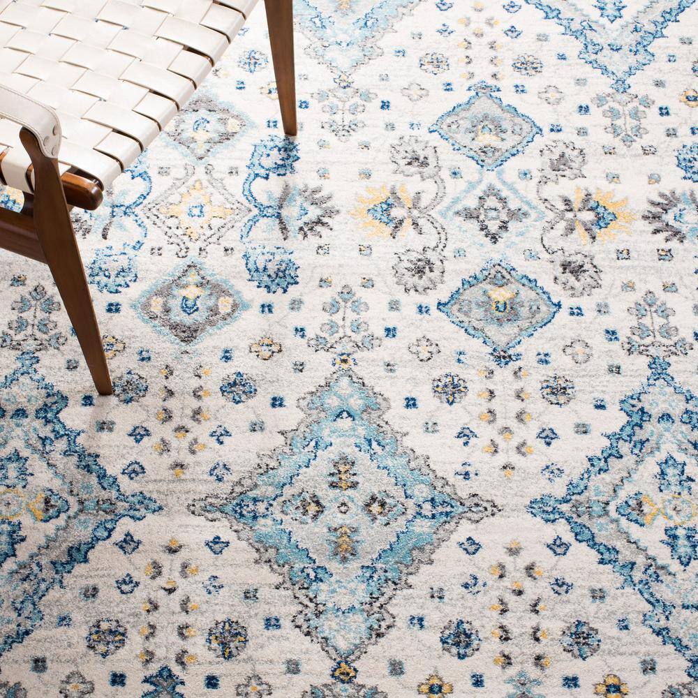 Ivory and Light Blue Floral Synthetic 9' x 12' Rectangular Area Rug