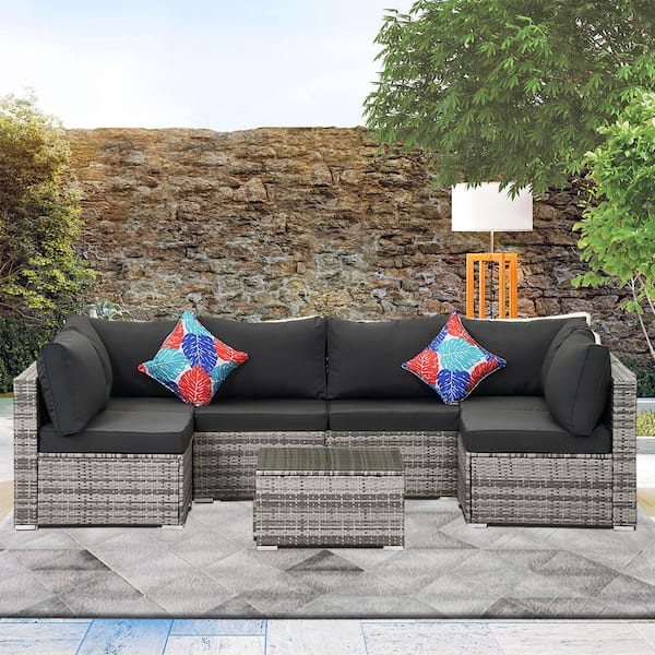 7-Piece Gray Wicker Outdoor Sectional Set with Gray Cushions and Coffee Table