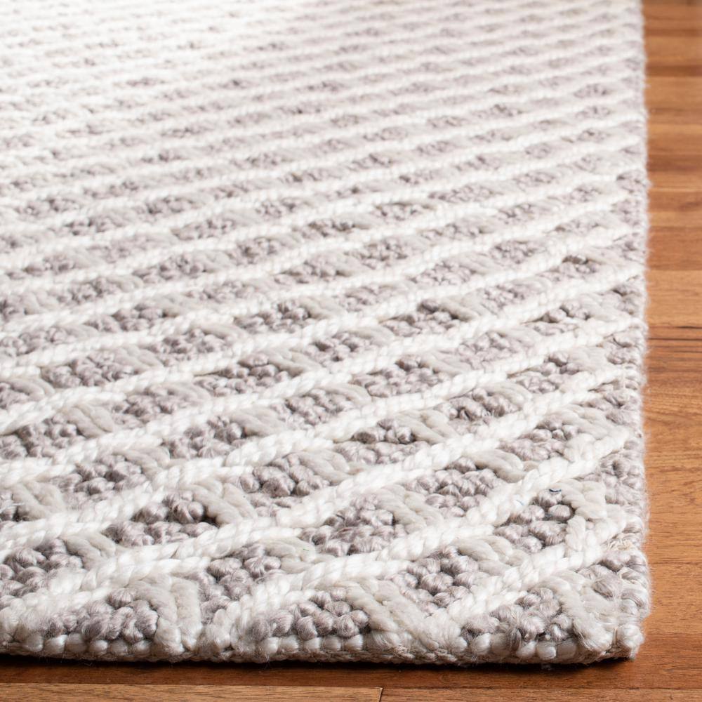 Ivory and Beige Braided Wool Area Rug, 5' x 8'