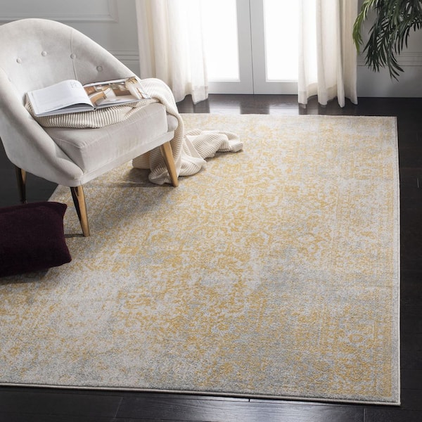 Evoke Ivory/Gold 7 ft. x 9 ft. Distressed Border Medallion Area Rug