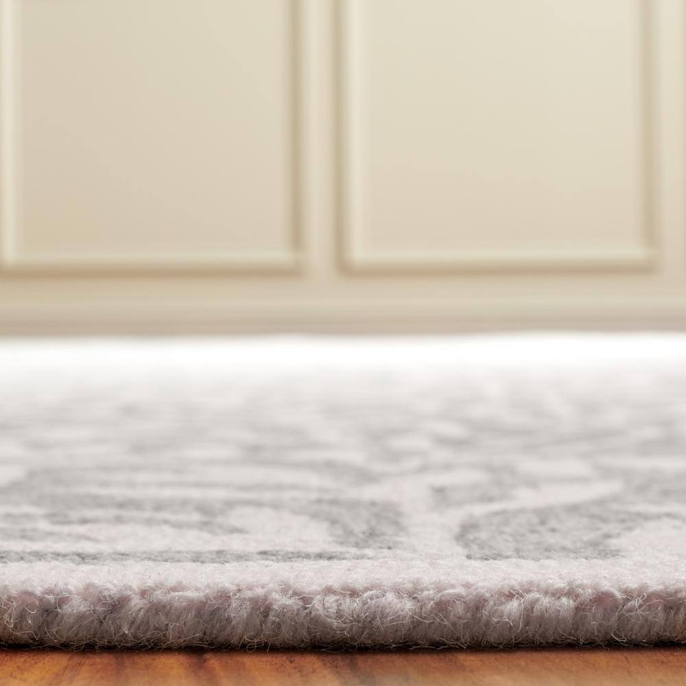 Grey and Ivory 4' x 6' Handmade Tufted Wool Area Rug
