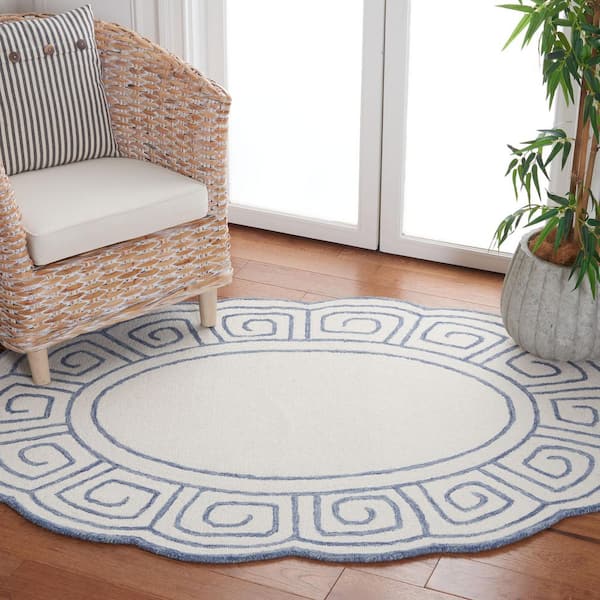 Novelty 3 ft. x 5 ft. Ivory/Blue Swirl Border Oval Area Rug