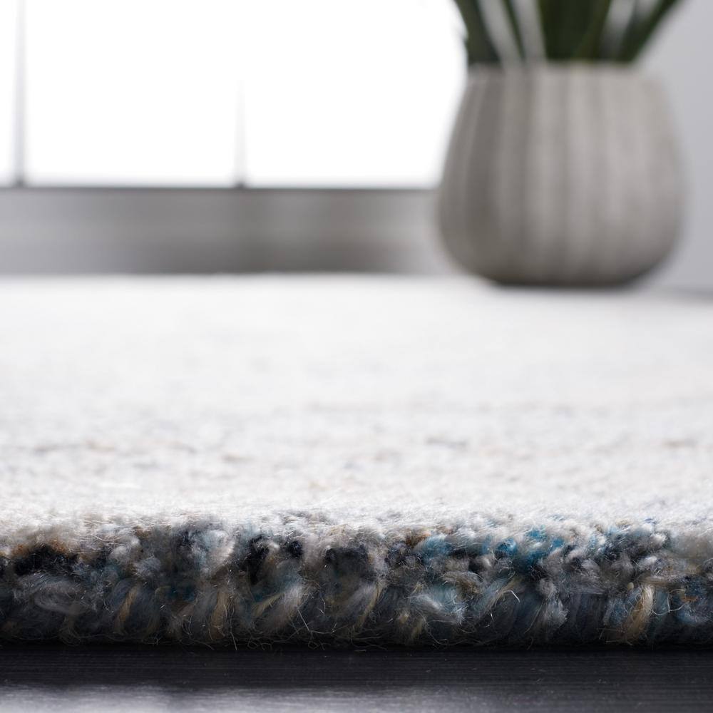 Blue and Beige Abstract Wool 8' x 10' Area Rug