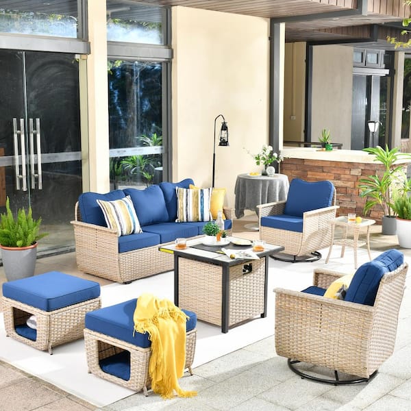 XIZZI Hera 7-Piece Wicker Outdoor Patio Fire Pit Seating Sofa Set with Navy Blue Cushions and Swivel Rocking Chairs