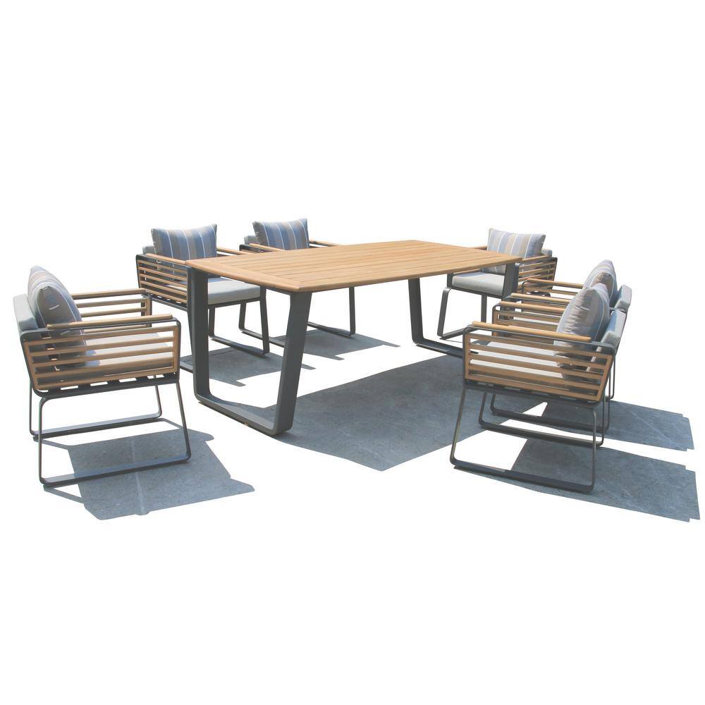 Outdoor dining set with wooden table and chairs on a paved area.
