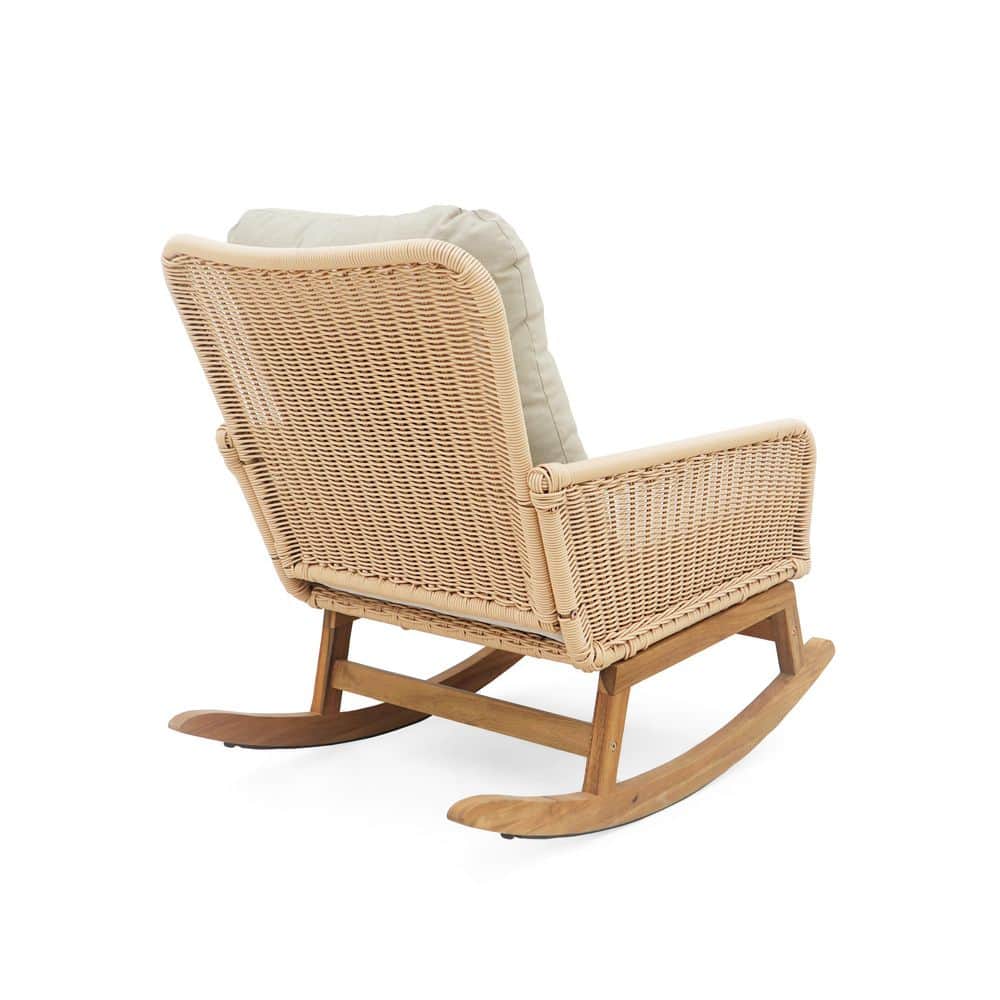 Beige wicker rocking chair in a lifestyle setting.