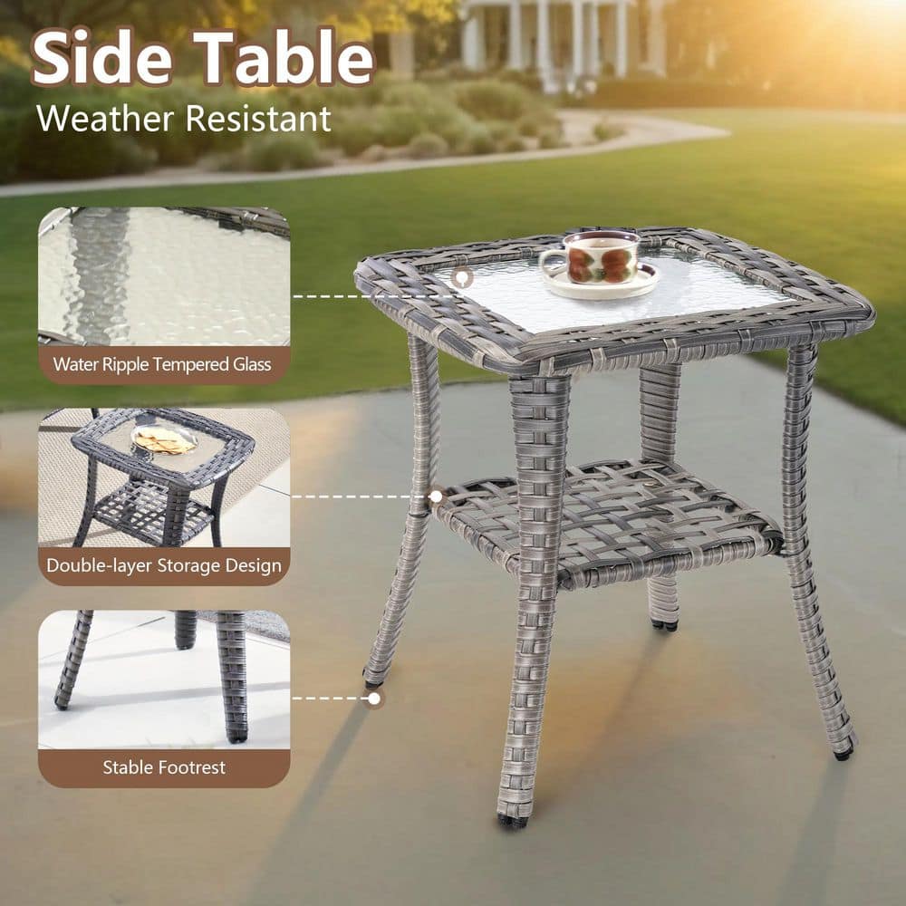 A gray wicker side table with a glass top and lower shelf.