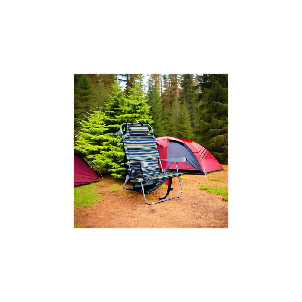 Folding chair set up outdoors next to a tent in a wooded area.