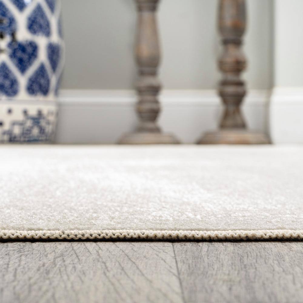 Cream 4' x 6' Synthetic Washable Rectangular Area Rug