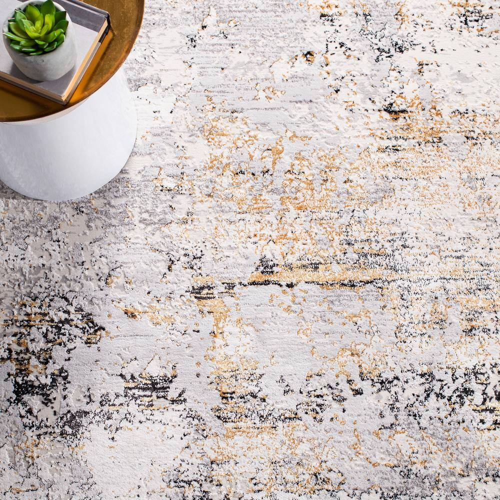 Cream and Gold Abstract 4' x 6' Stain-Resistant Area Rug