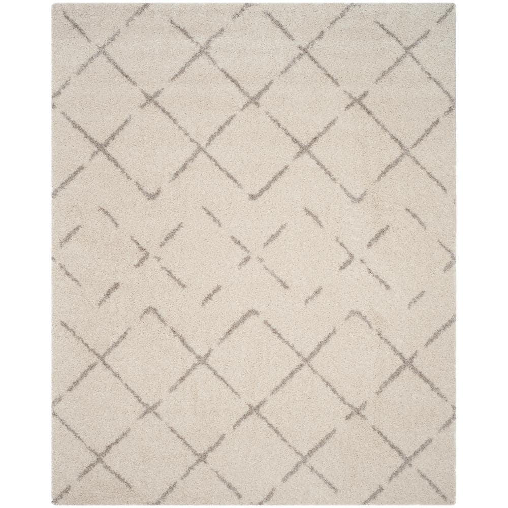 Ivory and Beige Geometric Shag 8' x 10' Area Rug