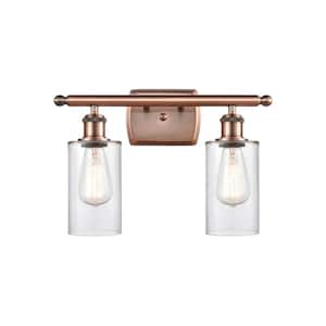 Clymer 16 in. 2-Light Antique Copper Vanity Light with Clear Glass Shade