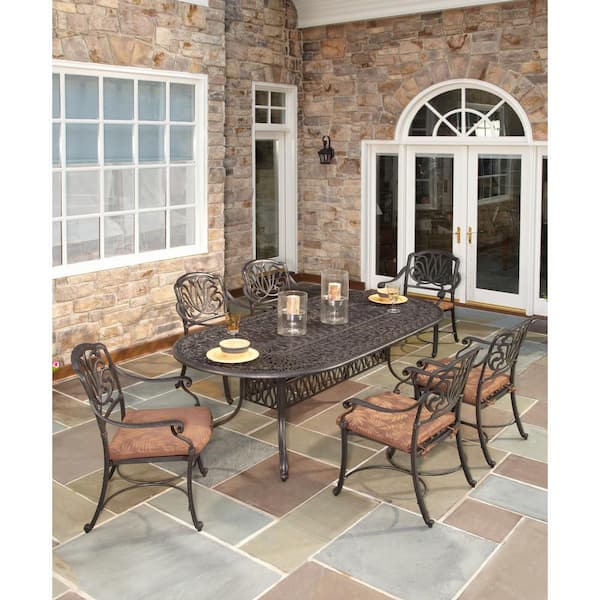 HOMESTYLES Capri Charcoal Gray 7-Piece Cast Aluminum Oval Outdoor Dining Set with with Burnt Sierra Orange Cushions