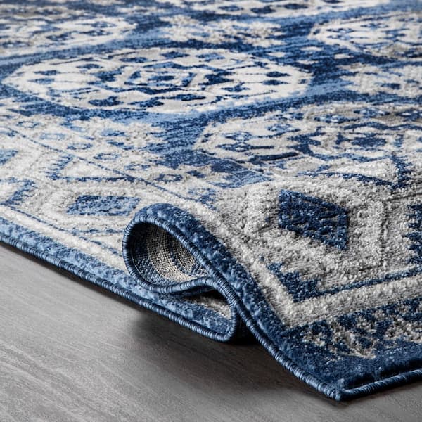 https://images.thdstatic.com/productImages/dc290458-f5f9-451e-b5ba-82bc8a8e4ea6/svn/blue-nuloom-area-rugs-rzsp21a-10014-1f_600.jpg